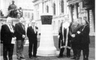 Pictured at the Magennis Memorial outside Belfast City Hall, L to R. Institute Deputy President Denis Ranaghan, Comdr. Ian Frazer, VC., The Lord Mayor of Belfast Cllr. Robert Stoker, Michael Magennis, Paul Magennis (Son) and Mary Magennis (Grand daughter) Mar. Inst. Photo: Pat Sweeney